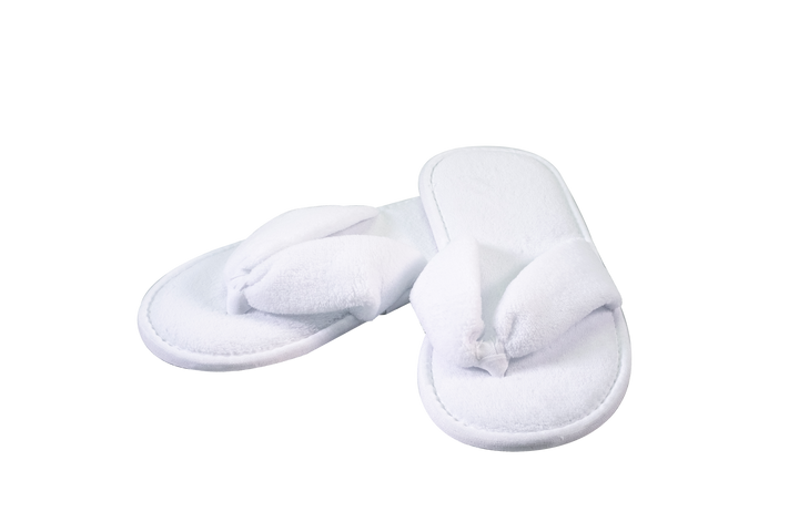 Pair of white slippers on a white background