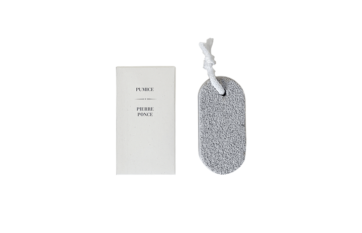 Pumice stone with a white label on a white background